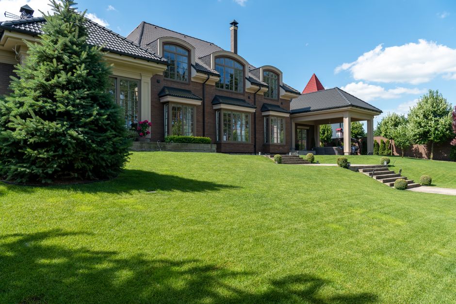Beautifully manicured green lawn and professional landscaping